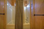 Main Floor Bathroom with a Tub Shower Combo 